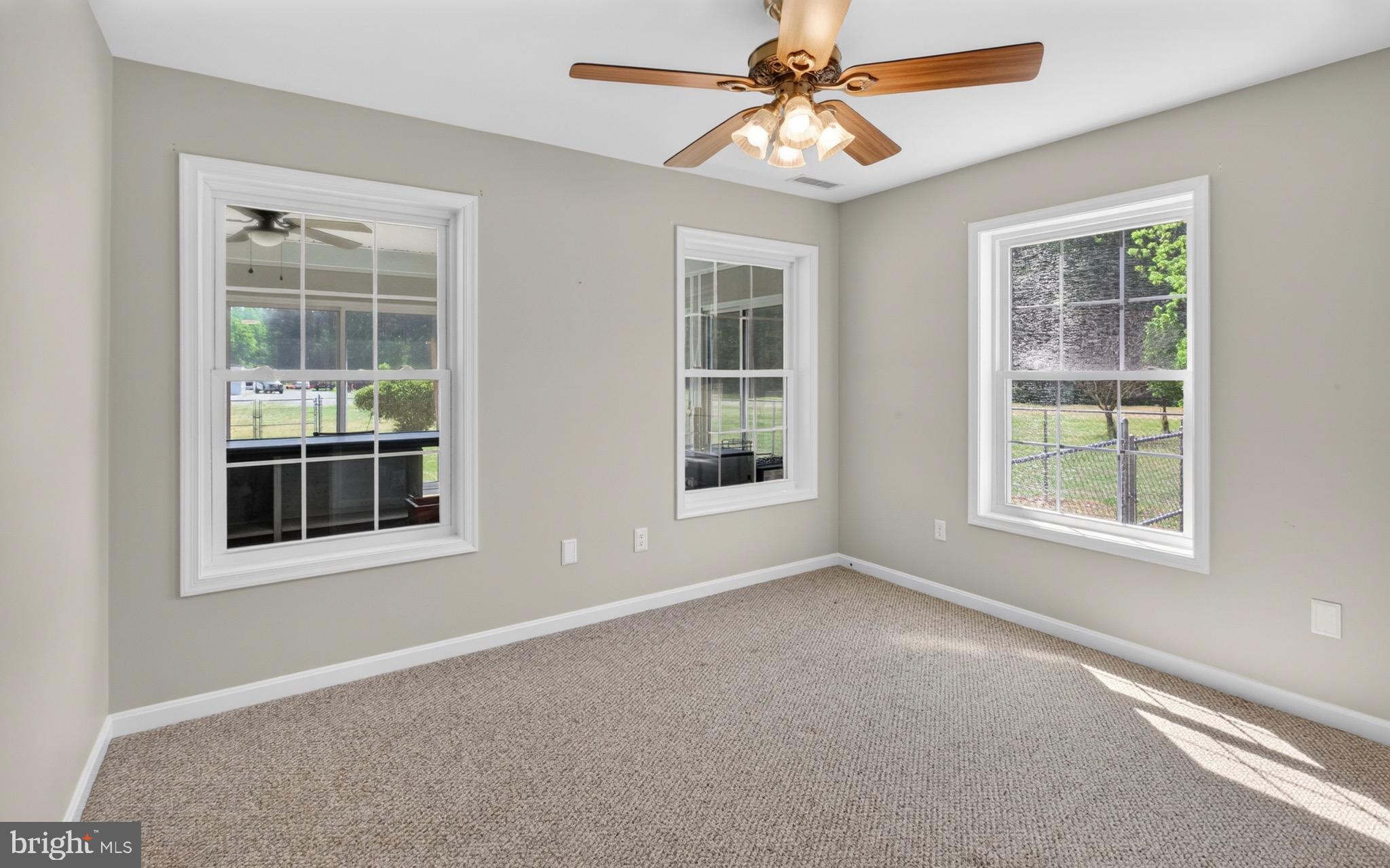 18315 Atlanta Road Bridgeville, DE 19933 - Photo 16 of 28 an empty room with windows and fan