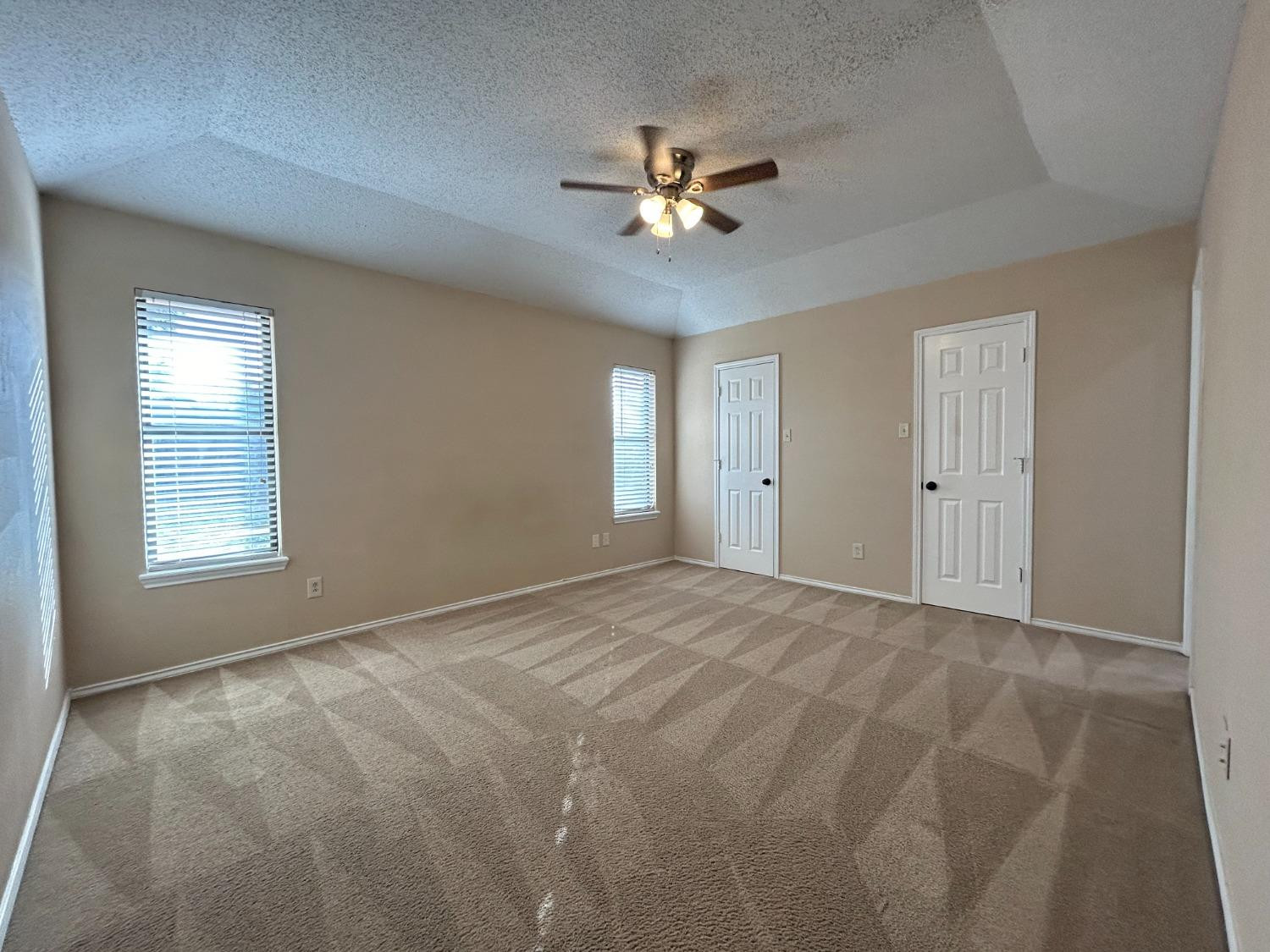 5917 74th Street Lubbock, TX 79424 - Photo 4 of 9 a view of an empty room with a window