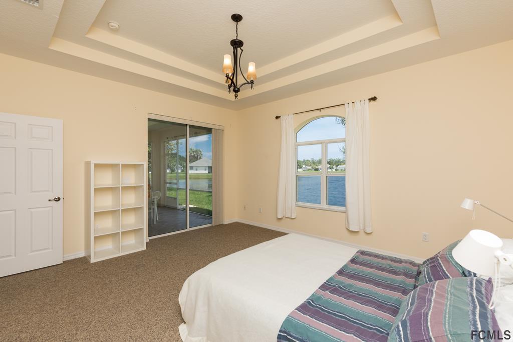 103 Raintree Circle Palm Coast, FL 32164 - Photo 19 of 43 Master bedroom