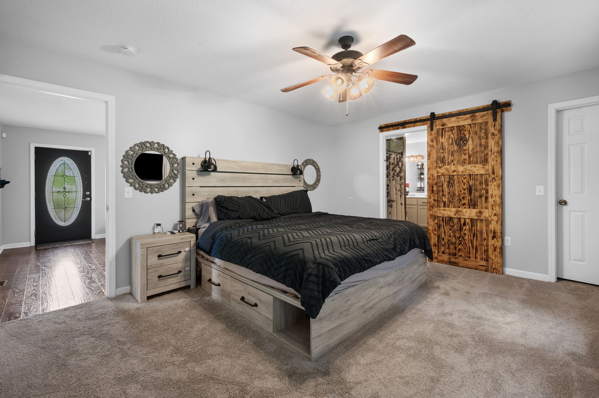 1197 Biter Road Cunningham, TN 37052 - Photo 15 of 38 a bedroom with a bed and a chandelier
