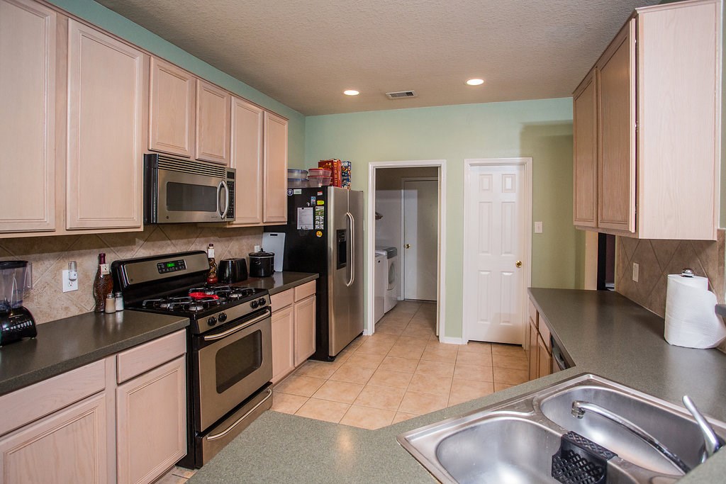 2930 Westerfield Lane Houston, TX 77084 - Photo 8 of 22 Look at all of the storage space in this large spacious kitchen. This kitchen is ready for your next family gathering.