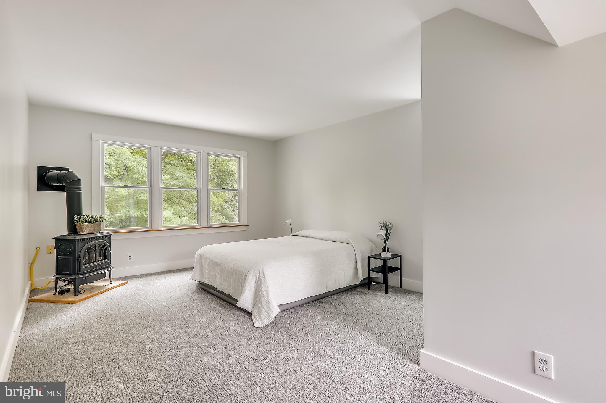 9311 Walden Road Silver Spring, MD 20901 - Photo 39 of 75 Primary Bedroom with Wood Stove