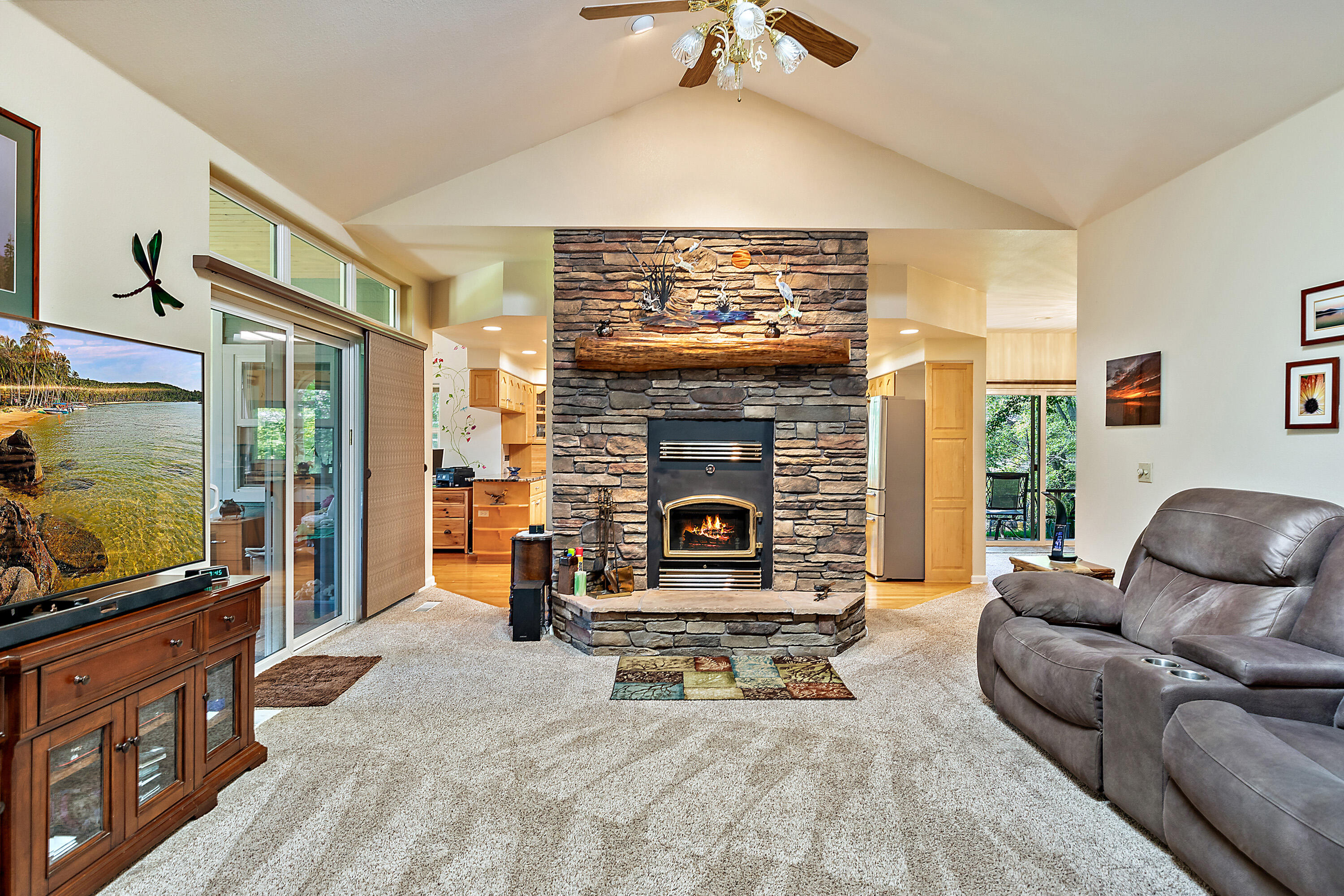 4000 Little Applegate Road Jacksonville, OR 97530 - Photo 12 of 47 a living room with furniture a flat screen tv and a fireplace