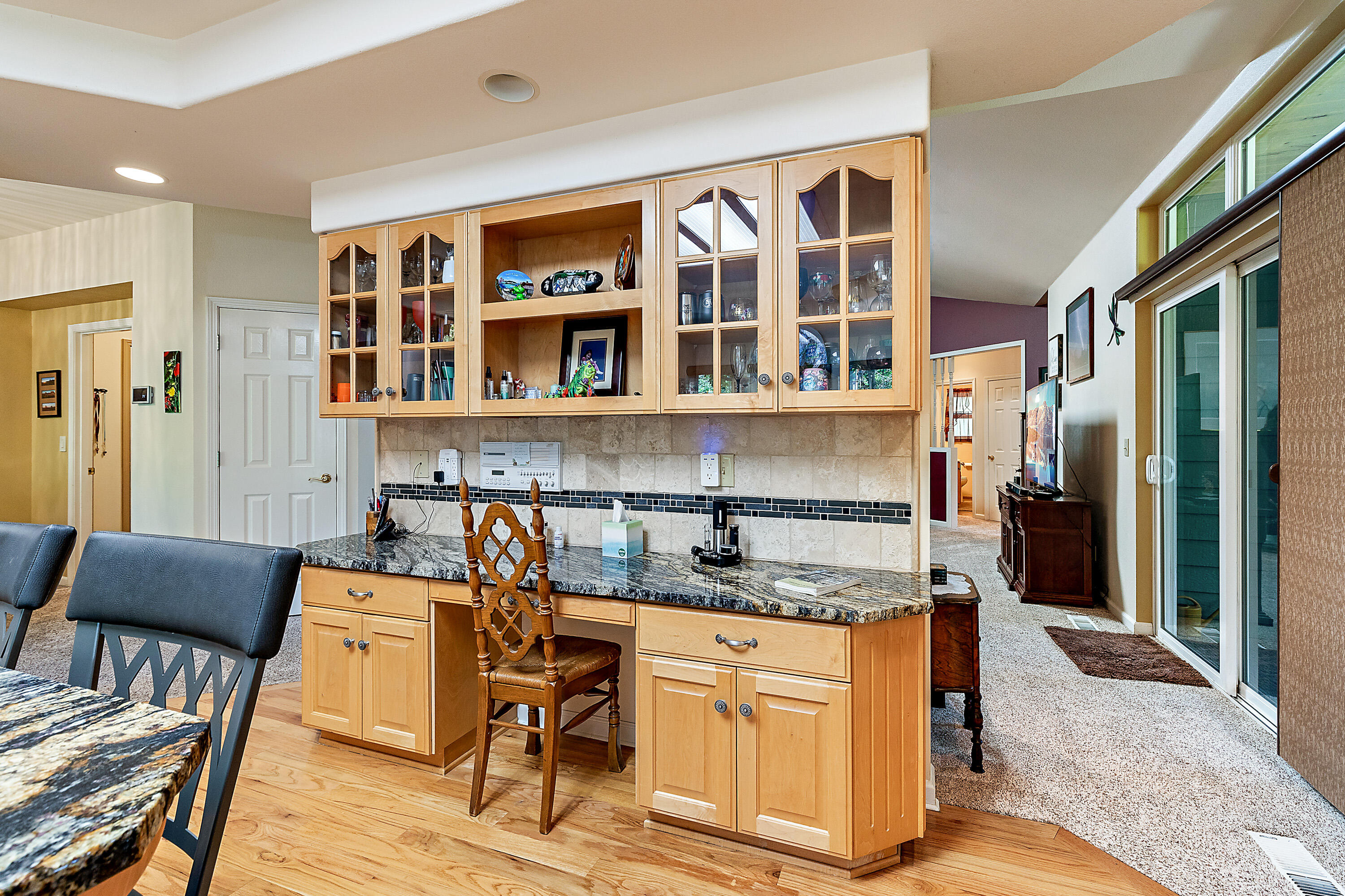 4000 Little Applegate Road Jacksonville, OR 97530 - Photo 17 of 47 a kitchen with a dining table chairs and refrigerator