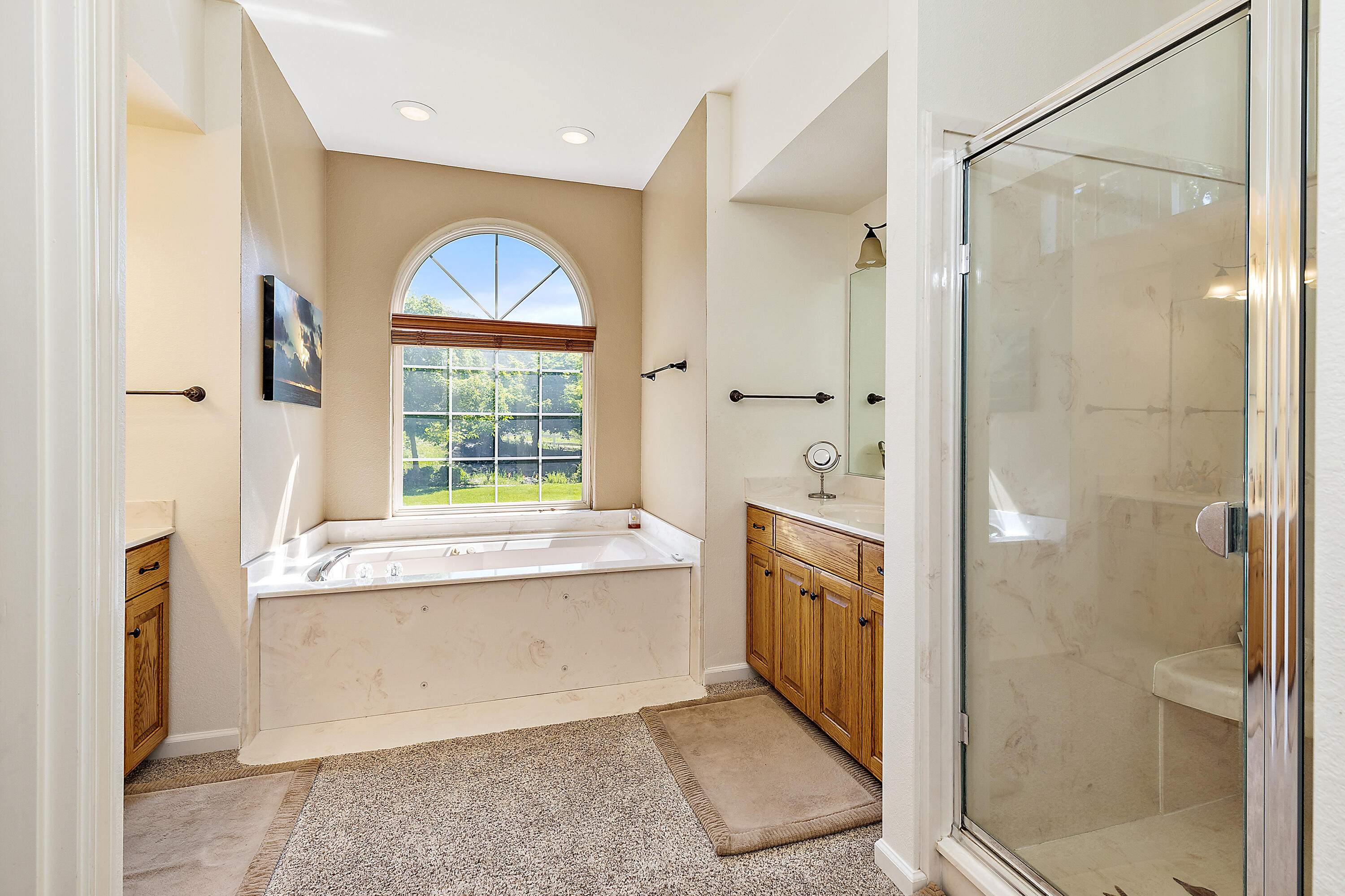 4000 Little Applegate Road Jacksonville, OR 97530 - Photo 25 of 47 a spacious bathroom with a granite countertop tub sink shower and mirror