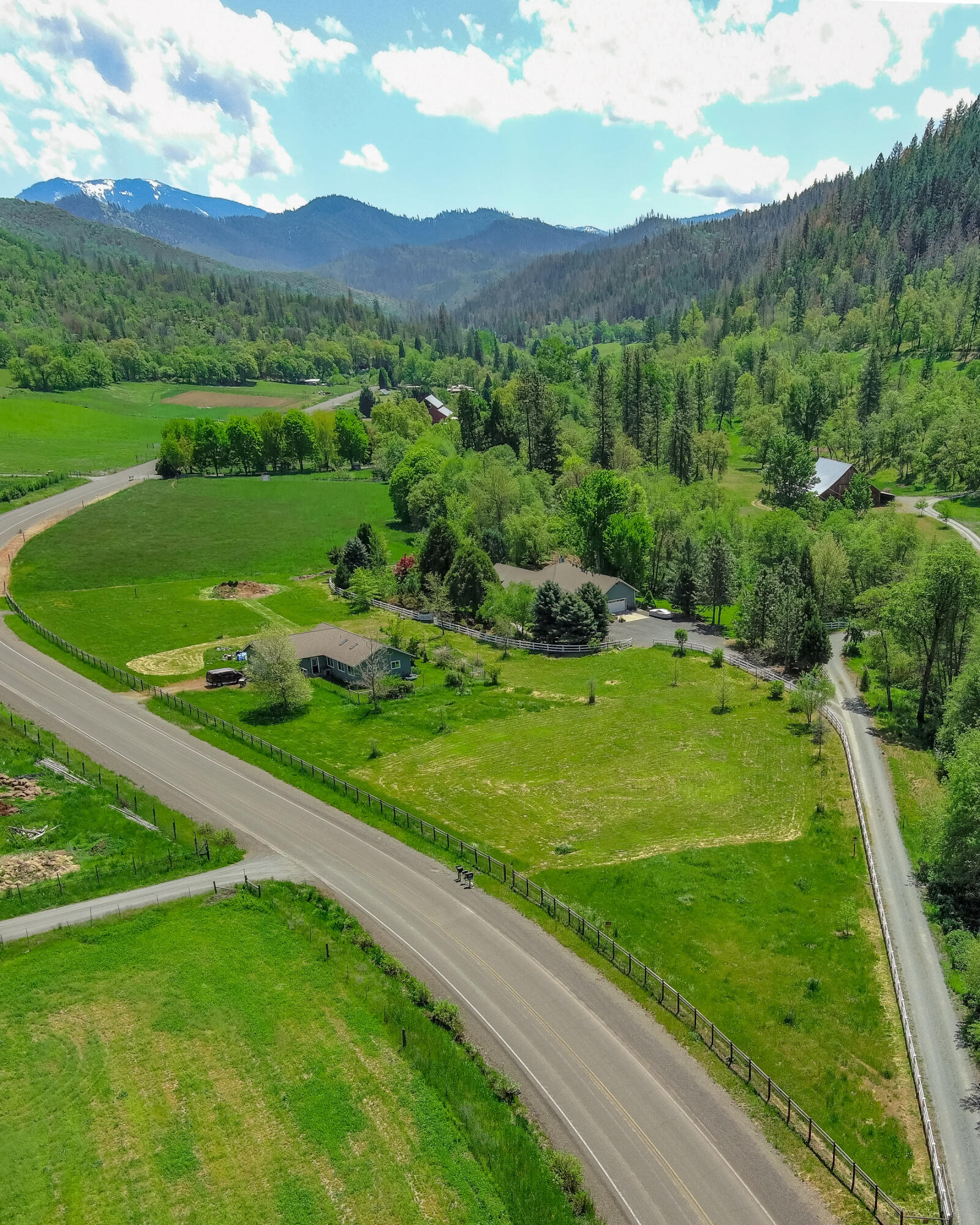 4000 Little Applegate Road Jacksonville, OR 97530 - Photo 37 of 47 a view of a lush green hillside and houses