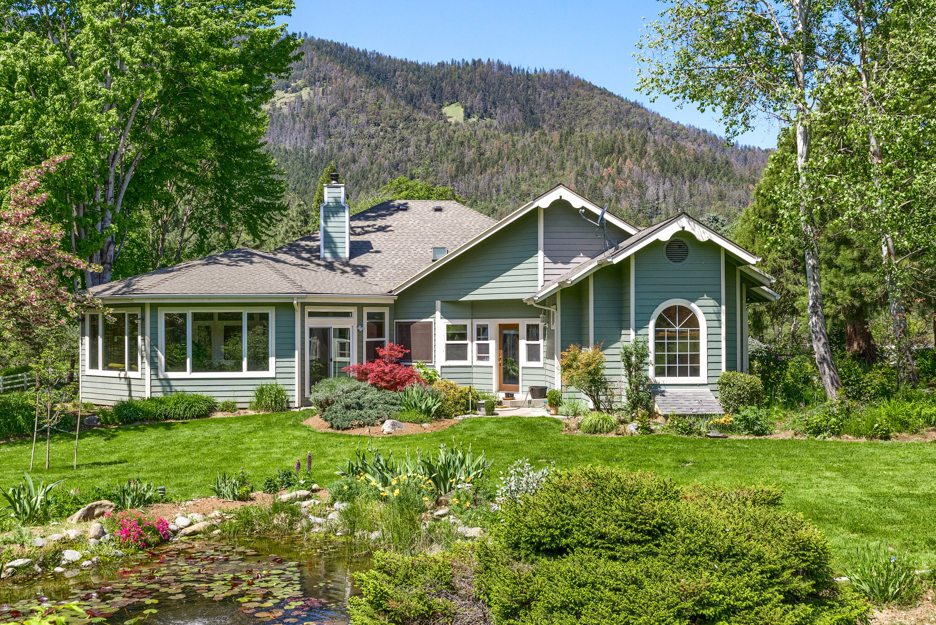 4000 Little Applegate Road Jacksonville, OR 97530 - Photo 40 of 47 a front view of a house with garden