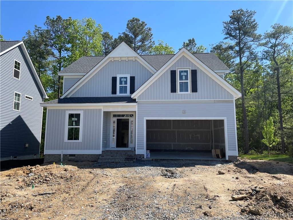 12907 Craftsbury Mews Midlothian, VA 23112 - Photo 1 of 14 a front view of a house with a yard covered with snow
