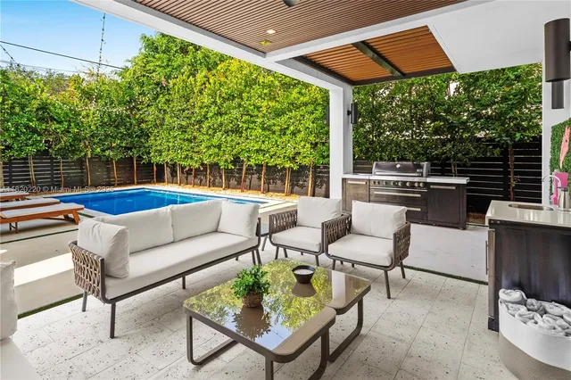 a view of a patio with couches chairs and a table