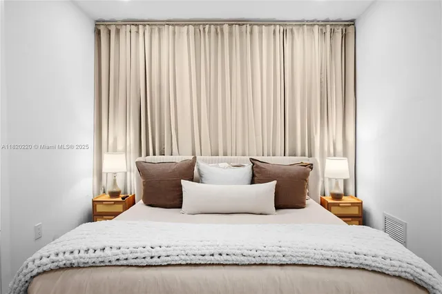 a view of a patio with a table and chairs