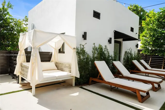 a bed room with a bed and a chair