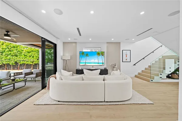 a living room with furniture and a large window