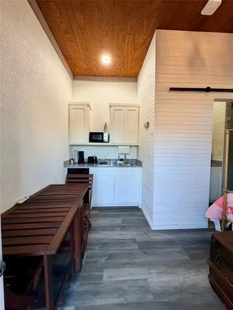 a kitchen with wooden cabinets and a sink