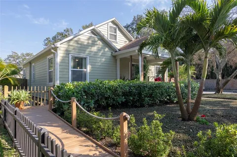 a view of a patio with table and chairs and potted plants