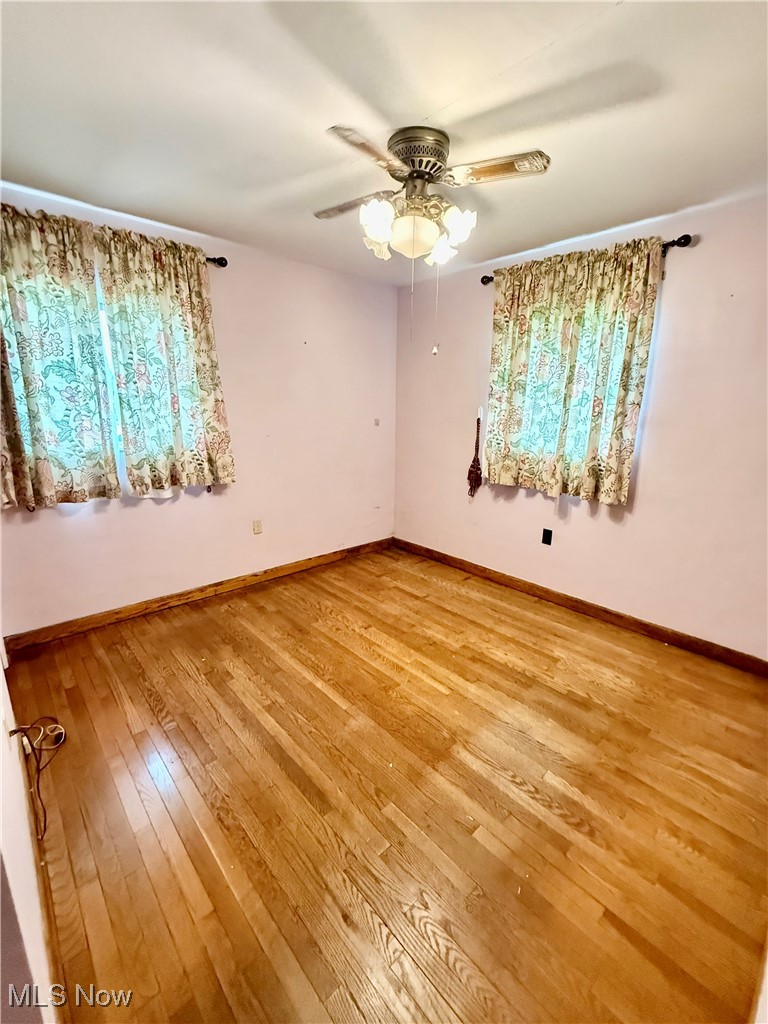 923 Archer Hill Road Colliers, WV 26035 - Photo 18 of 33 Empty room featuring light wood-style flooring and a ceiling fan