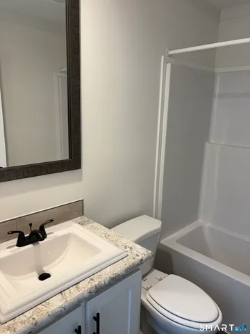 a bathroom with a shower and a tub