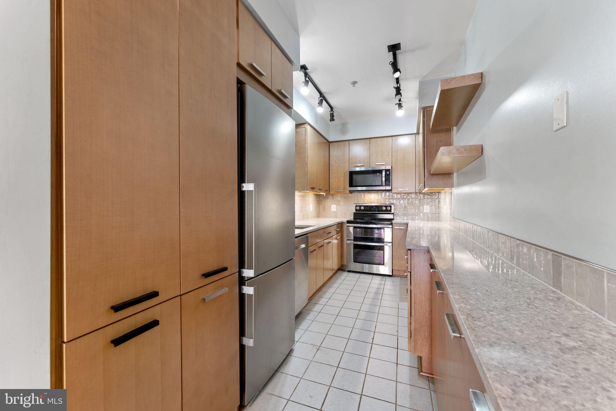 28 East Patrick Street, Unit 1 Frederick, MD 21701 - Photo 9 of 20 Kitchen w/granite counters & SS appliances