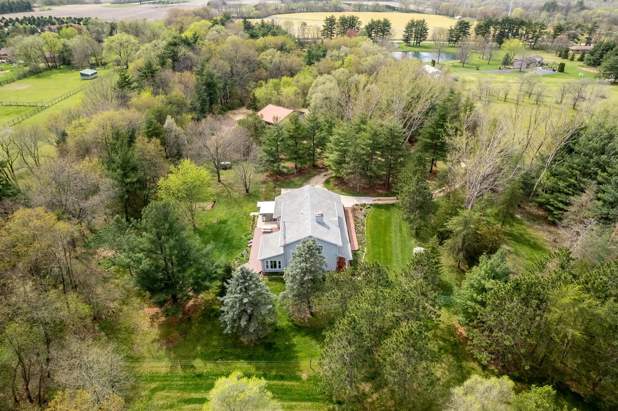 14795 Hansberry Road Rockton, IL 61072 - Photo 1 of 32 an aerial view of a house with a yard