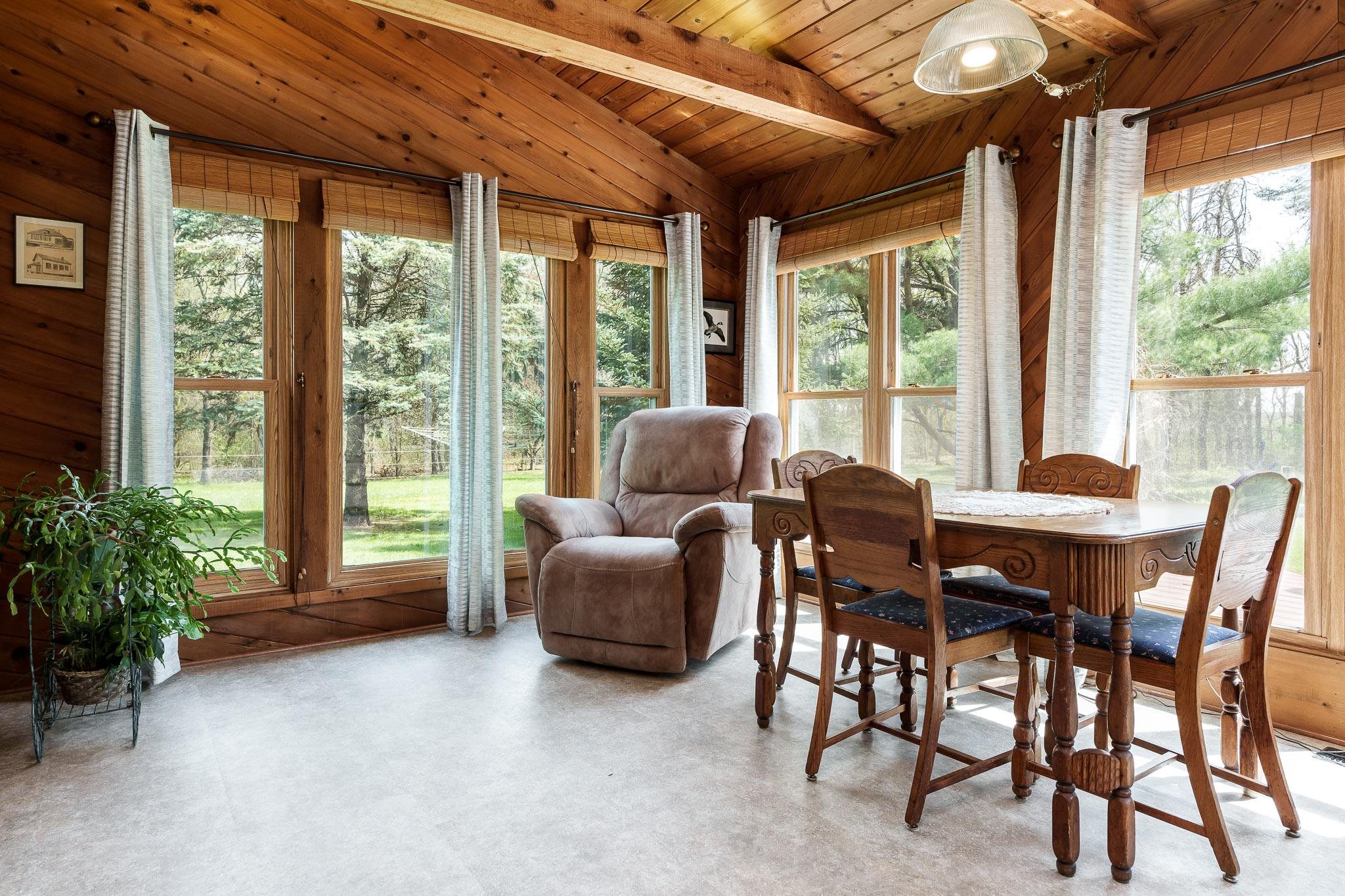 14795 Hansberry Road Rockton, IL 61072 - Photo 16 of 32 a dining room with furniture windows and outdoor view