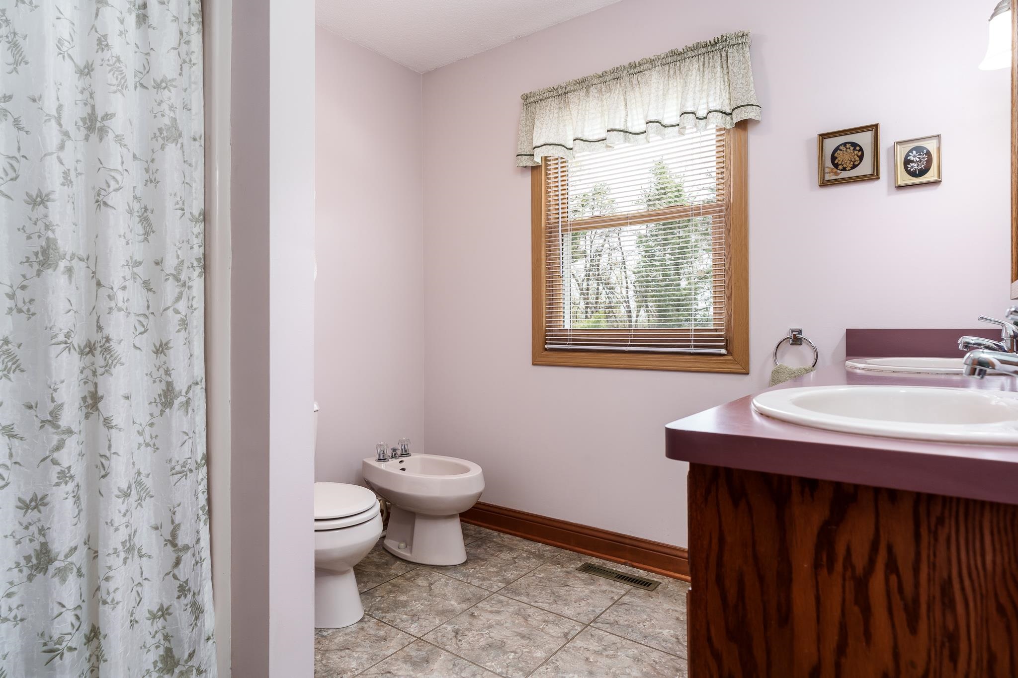 14795 Hansberry Road Rockton, IL 61072 - Photo 23 of 32 a bathroom with a sink toilet and a mirror