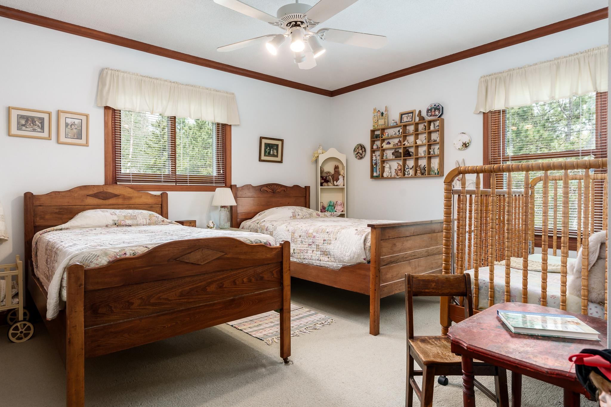 14795 Hansberry Road Rockton, IL 61072 - Photo 24 of 32 a bedroom with a bed and a dresser next to a window