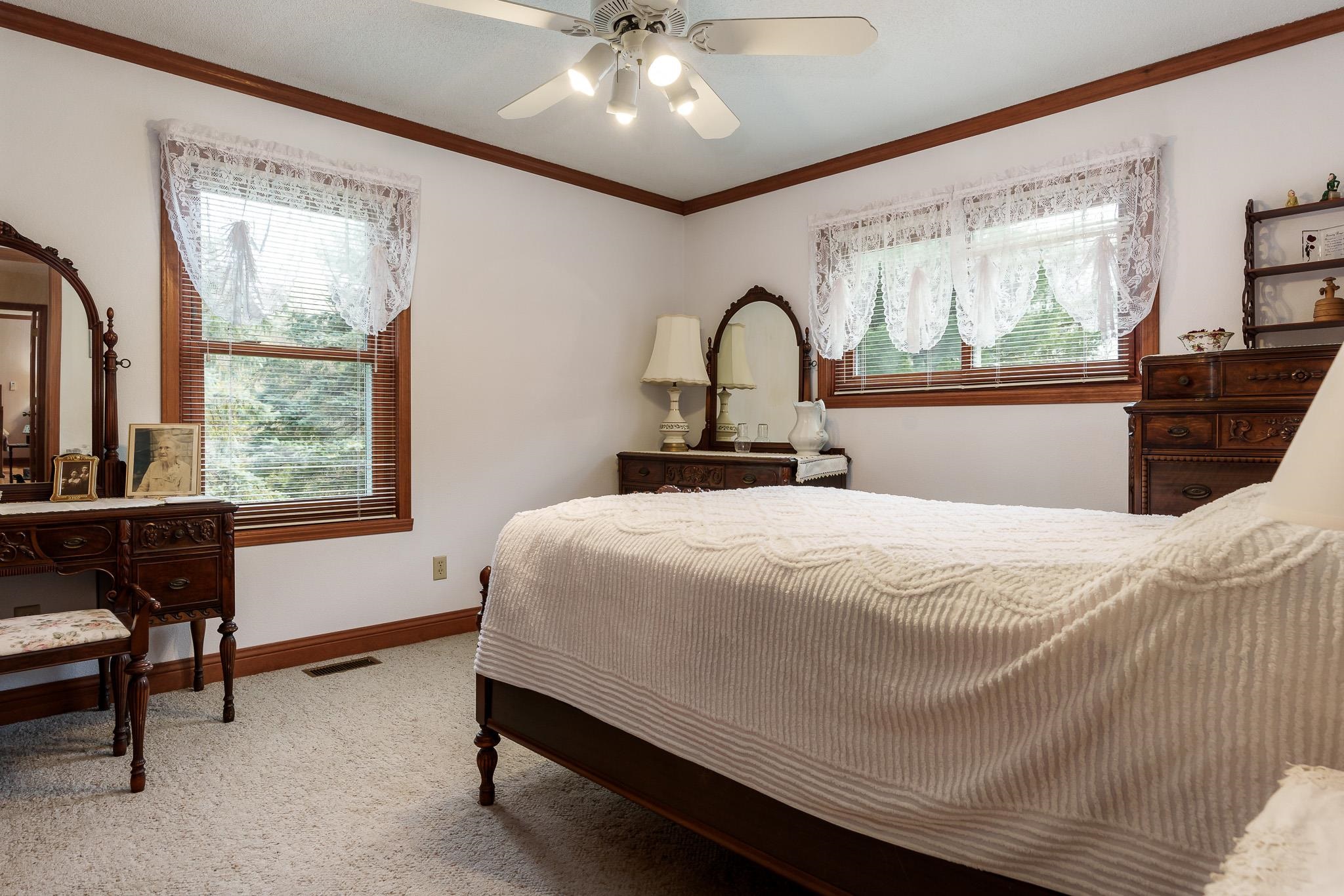 14795 Hansberry Road Rockton, IL 61072 - Photo 25 of 32 a bedroom with a bed and a table