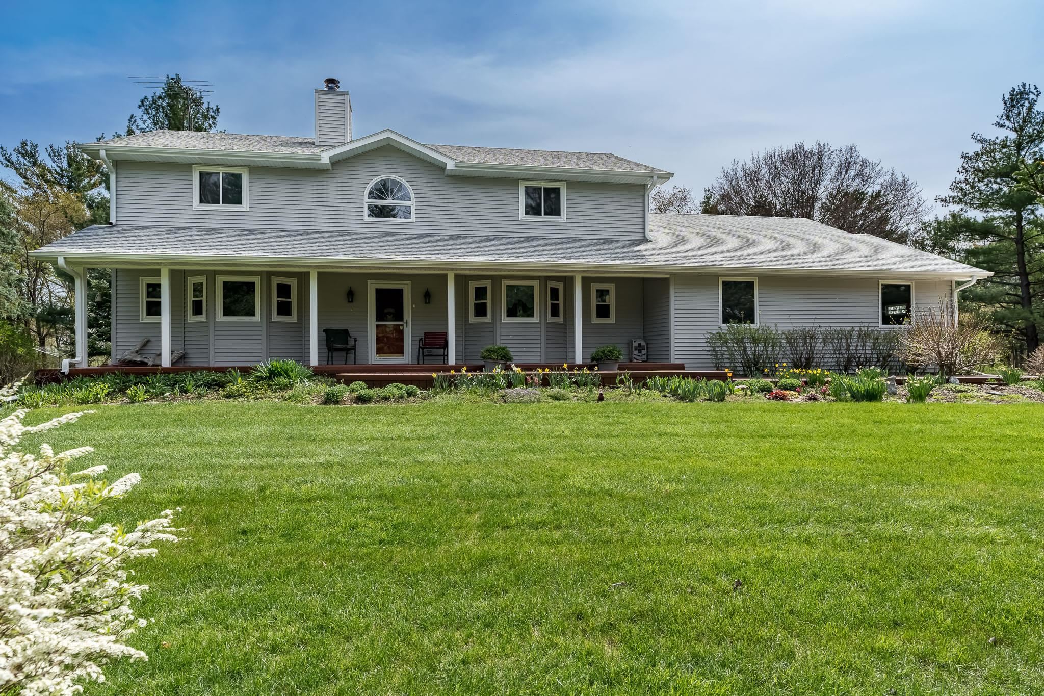 14795 Hansberry Road Rockton, IL 61072 - Photo 6 of 32 a front view of a house with garden and porch