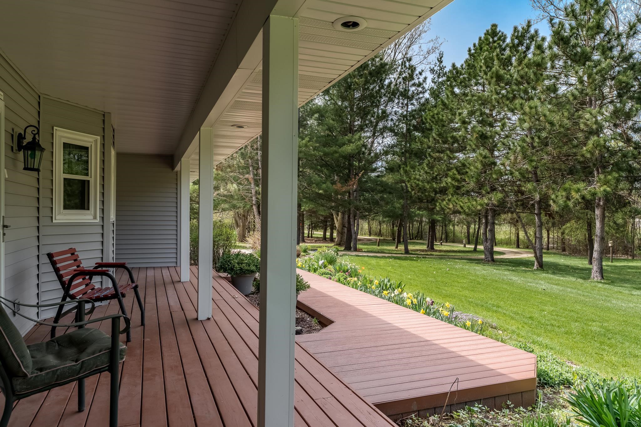 14795 Hansberry Road Rockton, IL 61072 - Photo 7 of 32 a view of a wooden deck and a yard