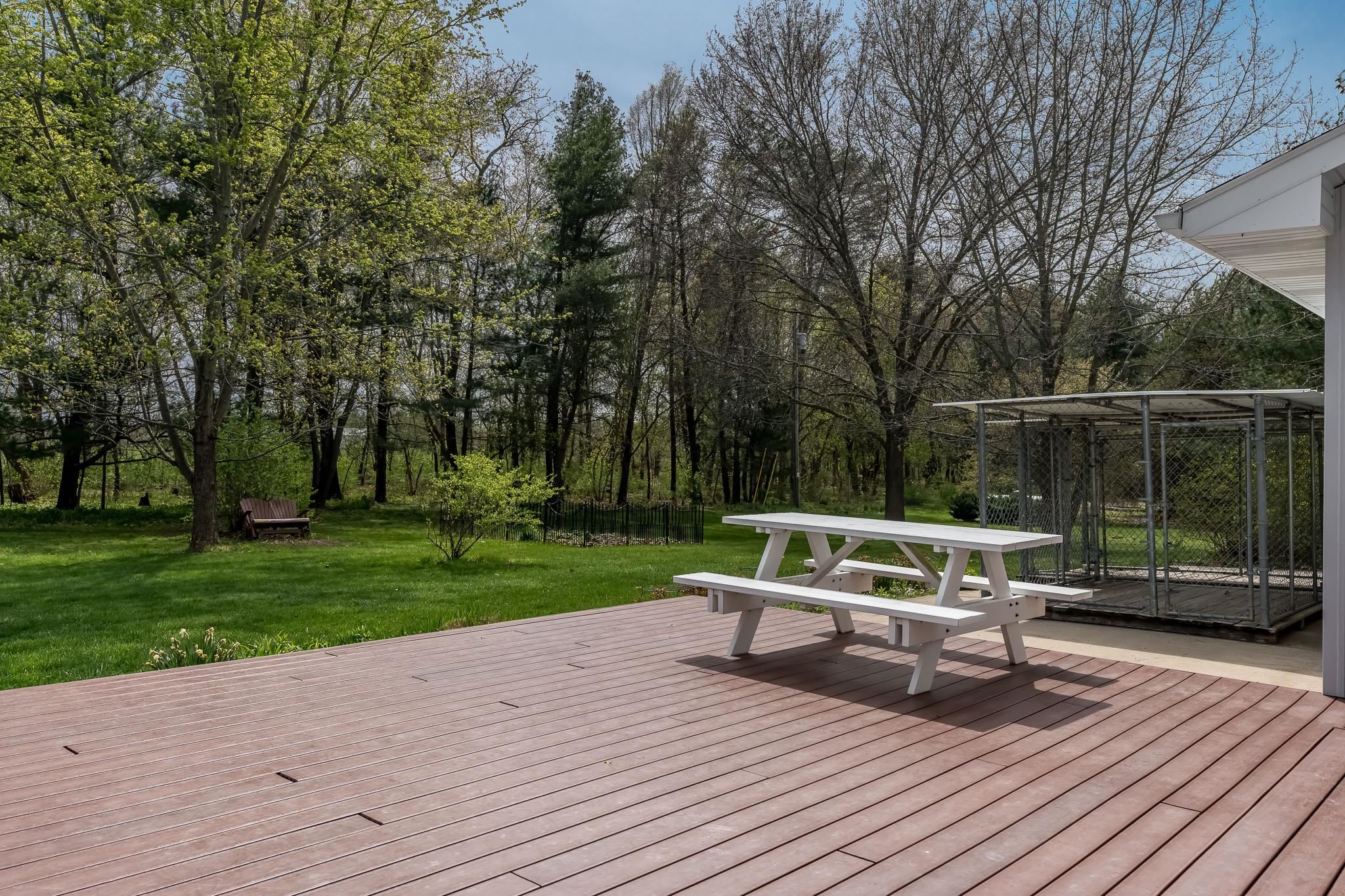 14795 Hansberry Road Rockton, IL 61072 - Photo 9 of 32 a view of house with deck outdoor seating and green space
