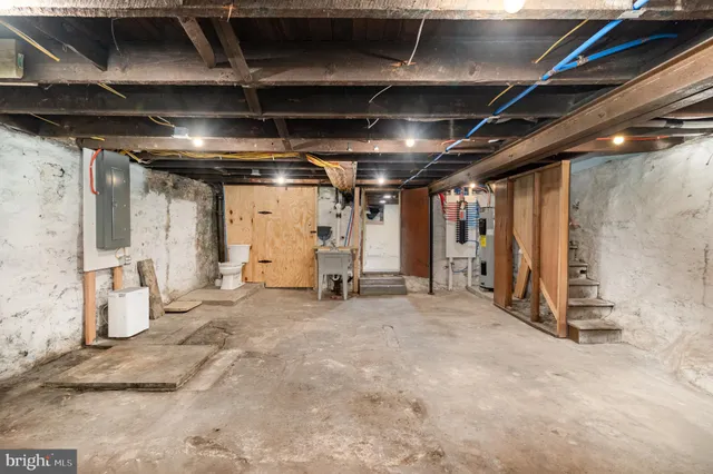 a view of an empty room with wooden walls