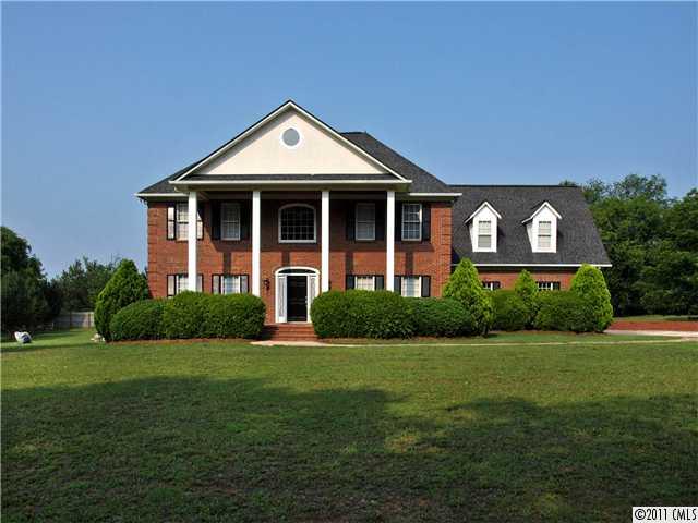 2653 Farmlake Lane Fort Mill, SC 29708 - Photo 1 of 16 a front view of a house with a yard