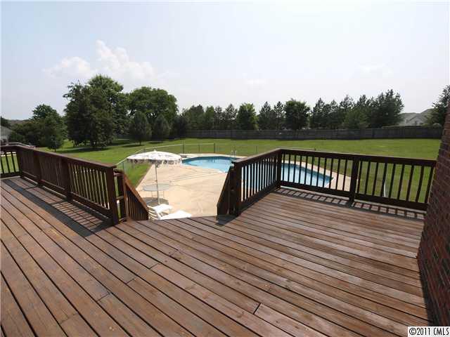 2653 Farmlake Lane Fort Mill, SC 29708 - Photo 15 of 16 a terrace with wooden floor and fence