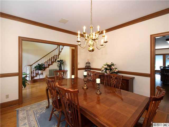2653 Farmlake Lane Fort Mill, SC 29708 - Photo 3 of 16 a view of a dining room with furniture and wooden floor