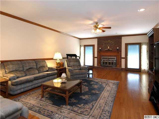 2653 Farmlake Lane Fort Mill, SC 29708 - Photo 4 of 16 a living room with furniture and wooden floor