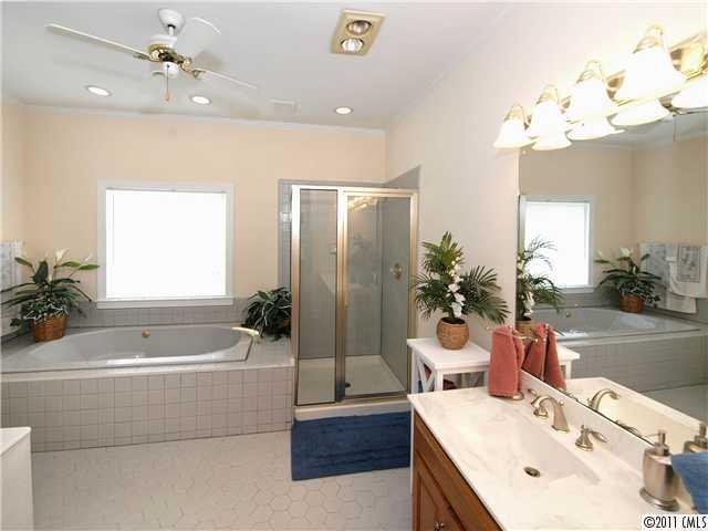 2653 Farmlake Lane Fort Mill, SC 29708 - Photo 9 of 16 a bathroom with a tub sink and mirror