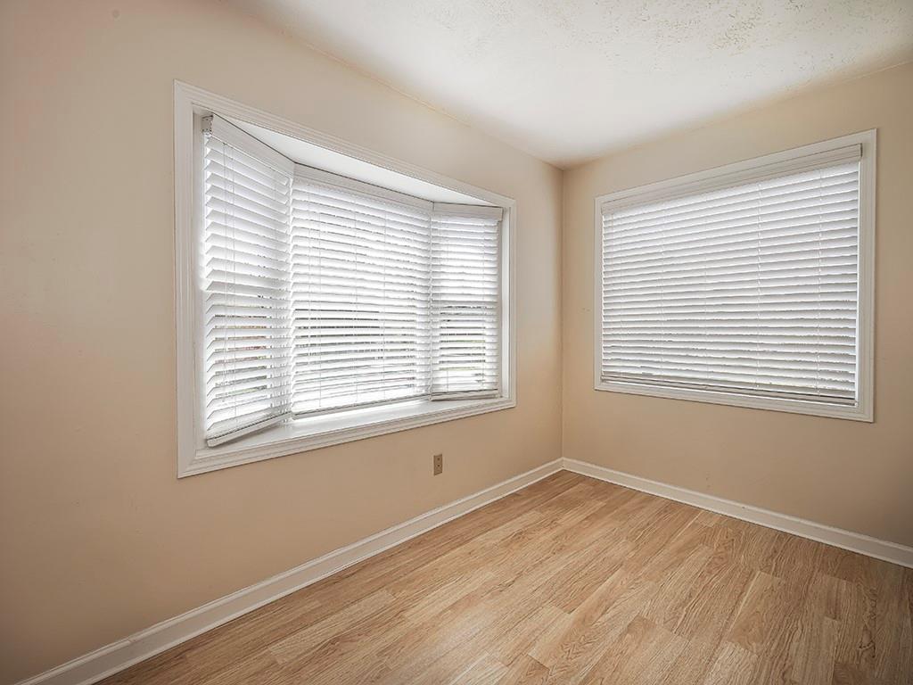 9151 Peebles Road Allison Park, PA 15101 - Photo 15 of 28 a view of an empty room with wooden floor and a window