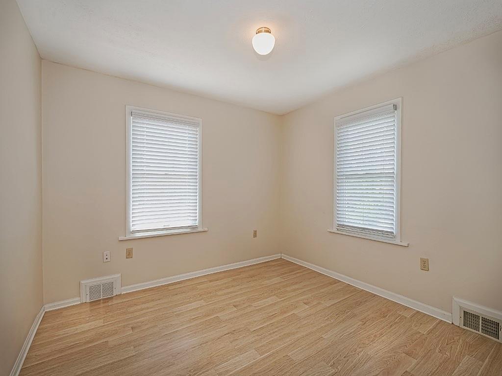 9151 Peebles Road Allison Park, PA 15101 - Photo 17 of 28 an empty room with wooden floor and windows