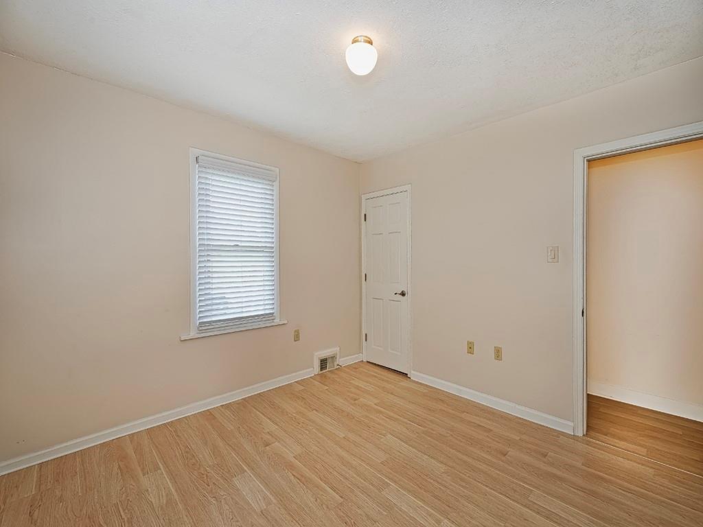 9151 Peebles Road Allison Park, PA 15101 - Photo 18 of 28 an empty room with wooden floor and windows