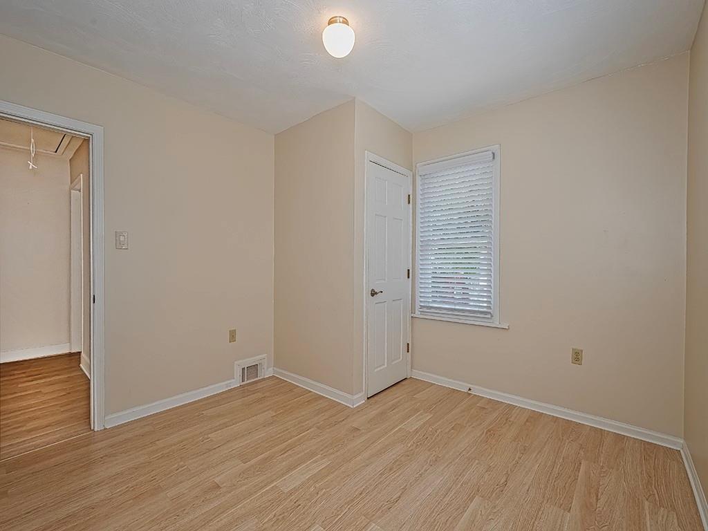 9151 Peebles Road Allison Park, PA 15101 - Photo 26 of 28 a view of an empty room with wooden floor and a window