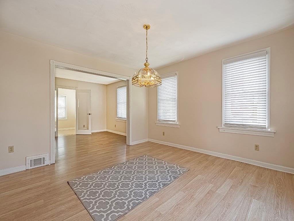 9151 Peebles Road Allison Park, PA 15101 - Photo 6 of 28 a view of an empty room with window and wooden floor