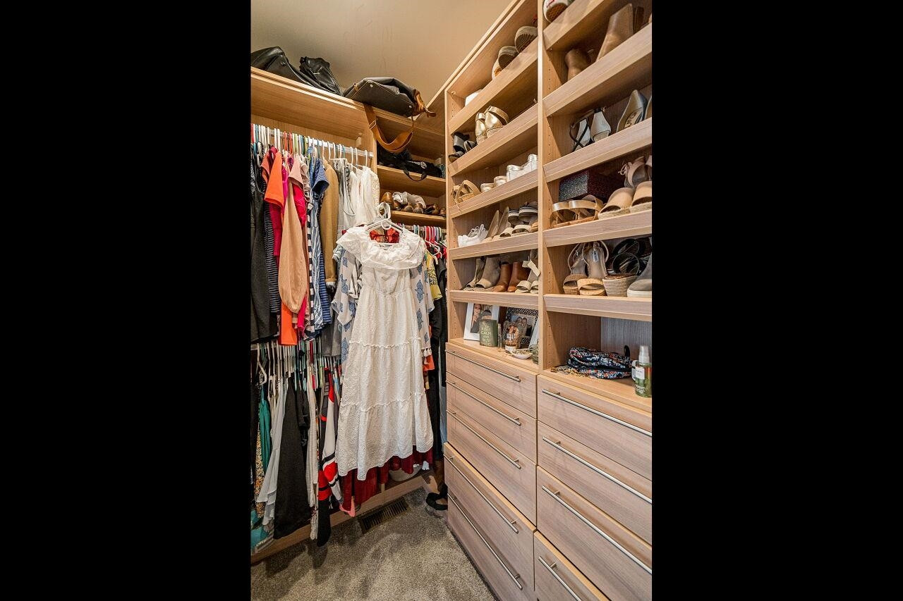 1517 Fullerton Place Raleigh, NC 27607 - Photo 23 of 30 Custom California Closets design for this walk in closet you won't forget or want to leave! Owner's Closet