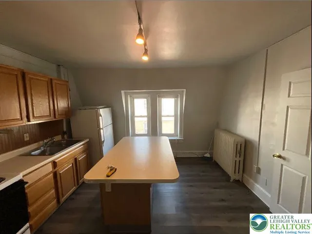 a large spacious bathroom with a sink and a mirror
