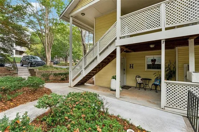 a view of a house with porch and furniture