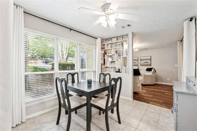a view of a dining room with furniture window and outside view