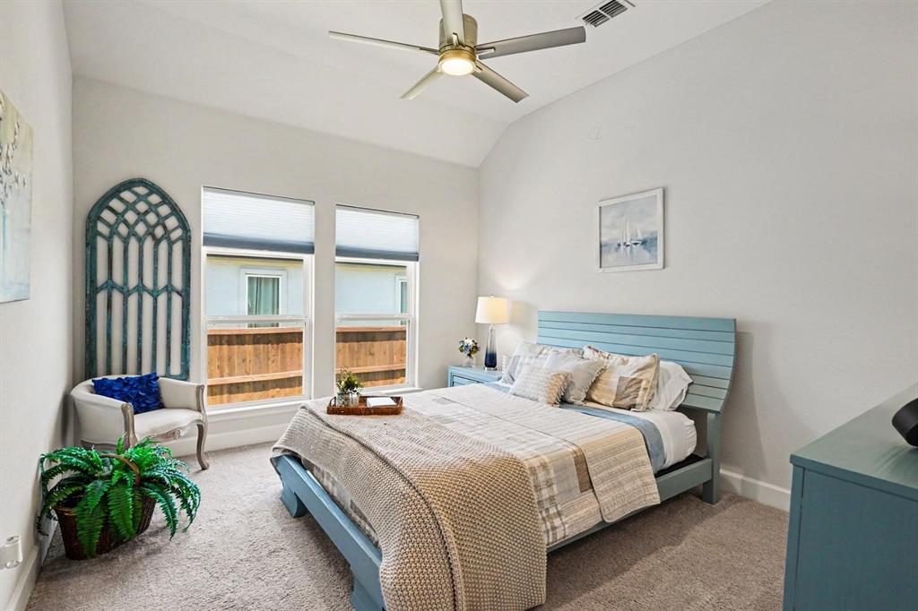 573 Broadleaf Way Haslet, TX 76052 - Photo 21 of 35 a bedroom with a bed and a large window