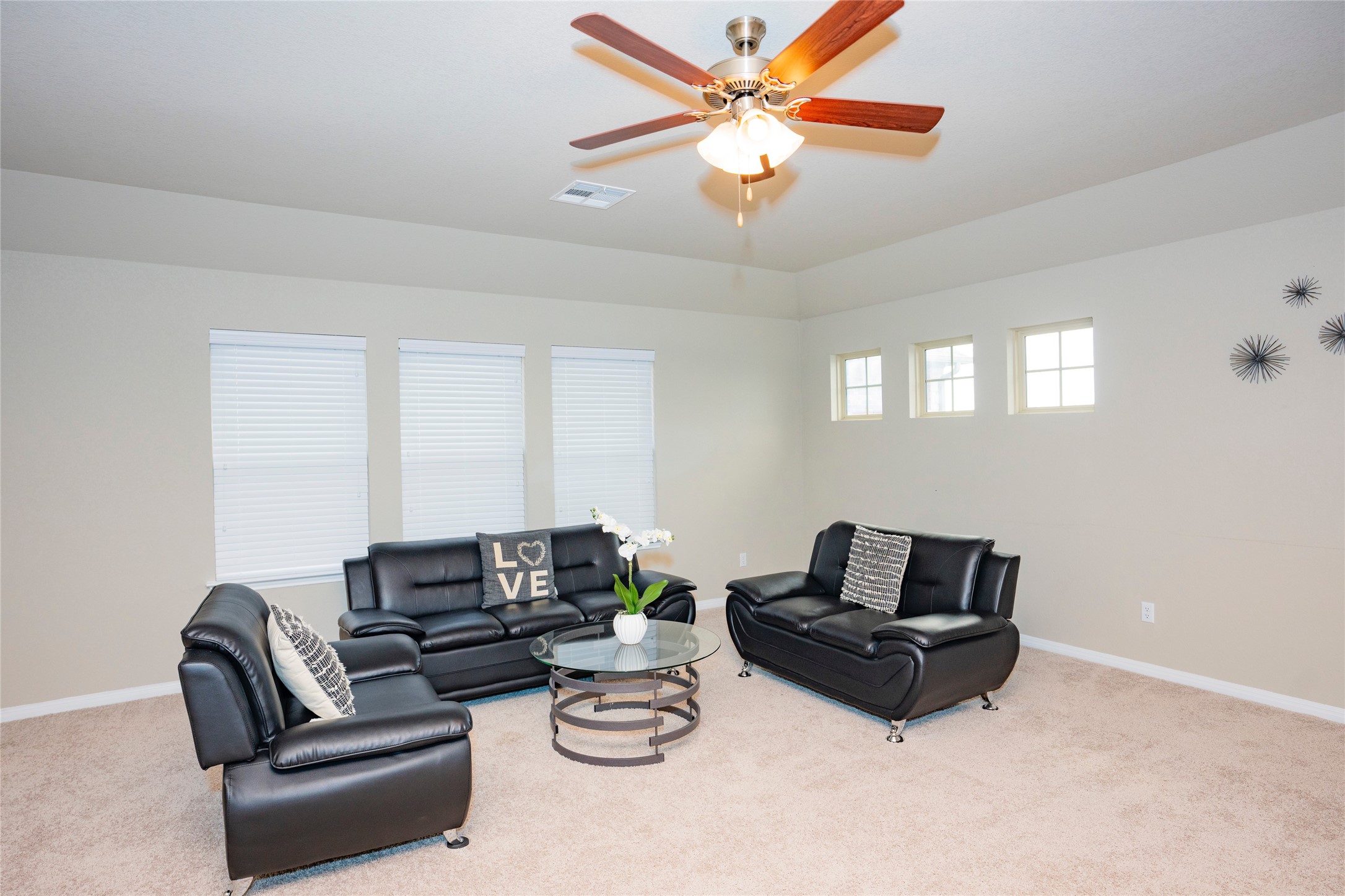 20916 Carries Ranch Road Pflugerville, TX 78660 - Photo 13 of 40 a living room with furniture a couch and a chandelier