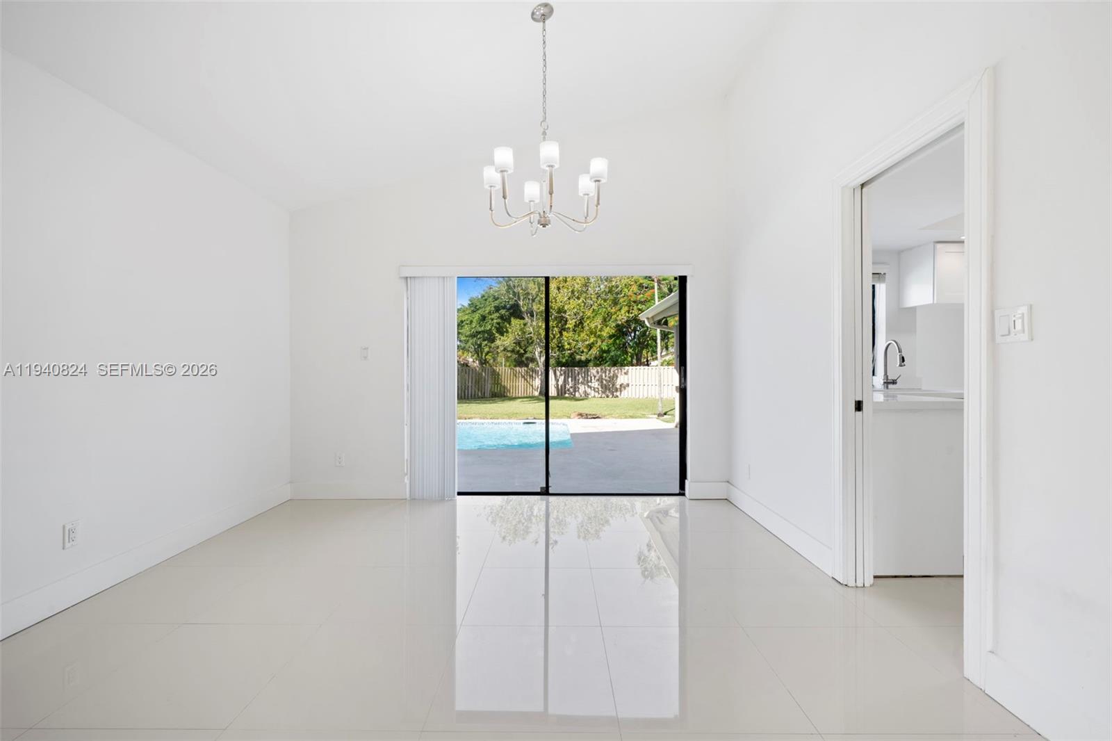 10424 Southwest 114th Court Miami, FL 33176 - Photo 17 of 23 a view of an empty room with a window