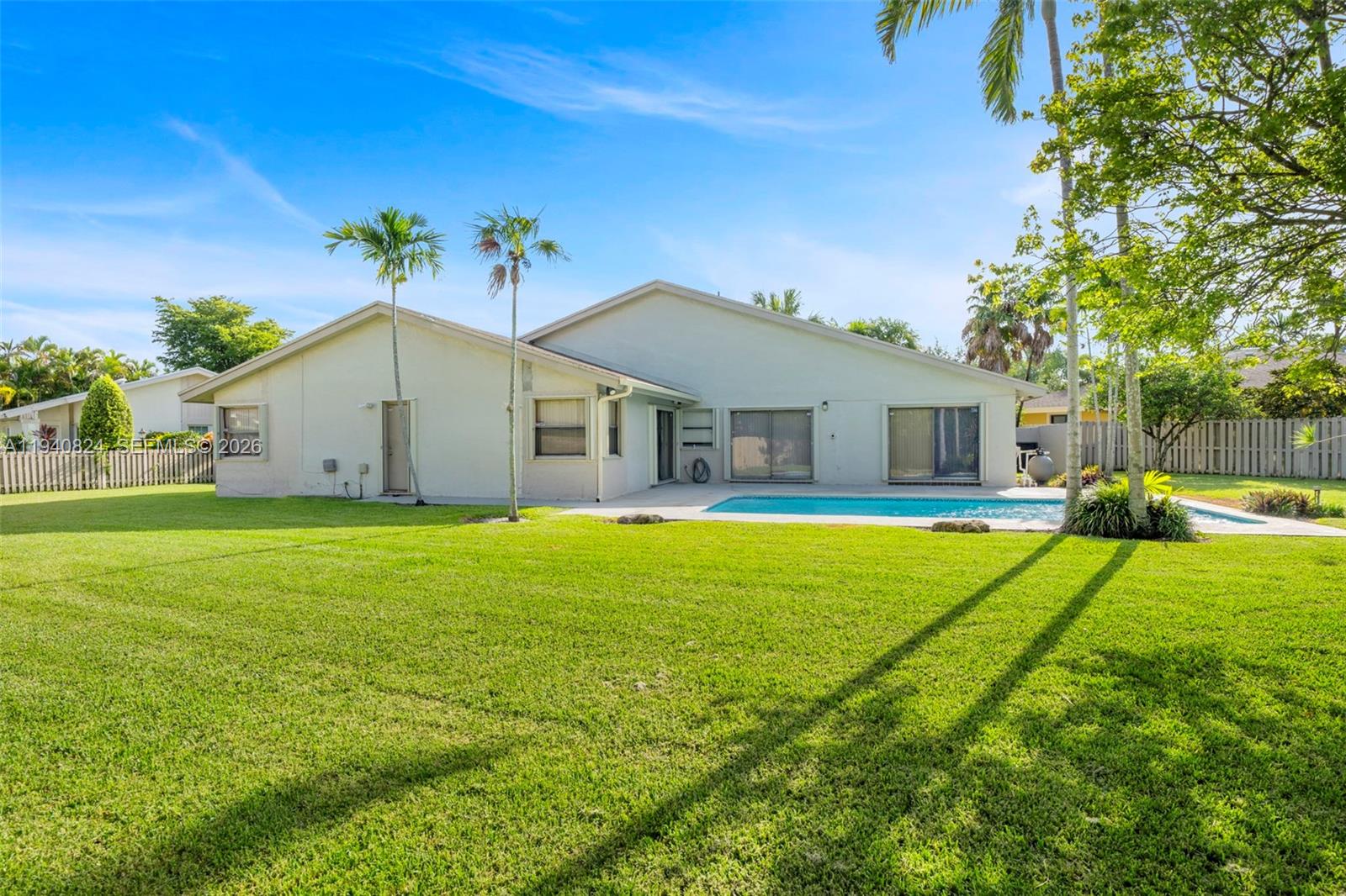 10424 Southwest 114th Court Miami, FL 33176 - Photo 21 of 23 a house view with swimming pool in front of it