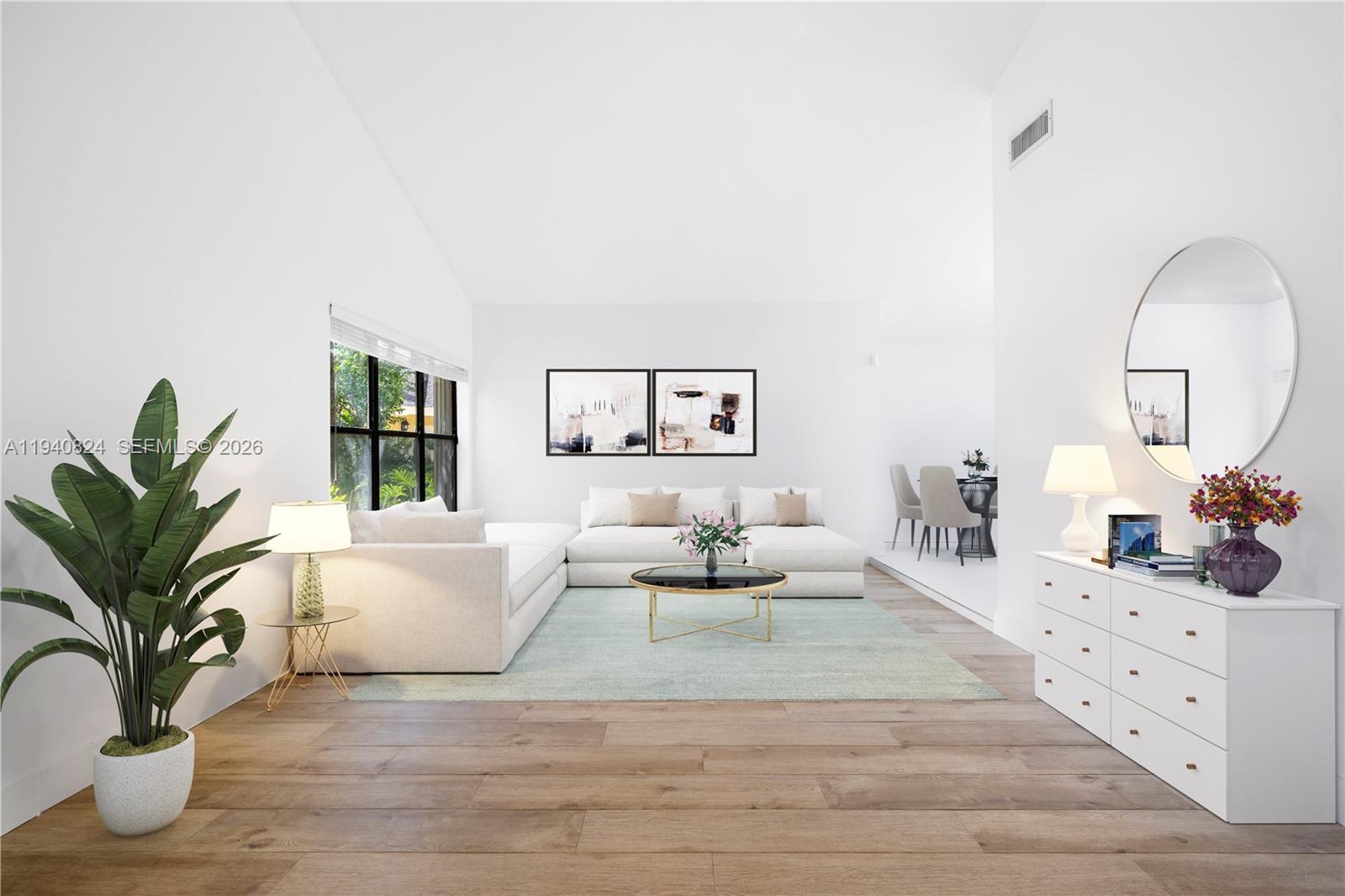 10424 Southwest 114th Court Miami, FL 33176 - Photo 4 of 23 a living room with furniture potted plant and a wooden floor