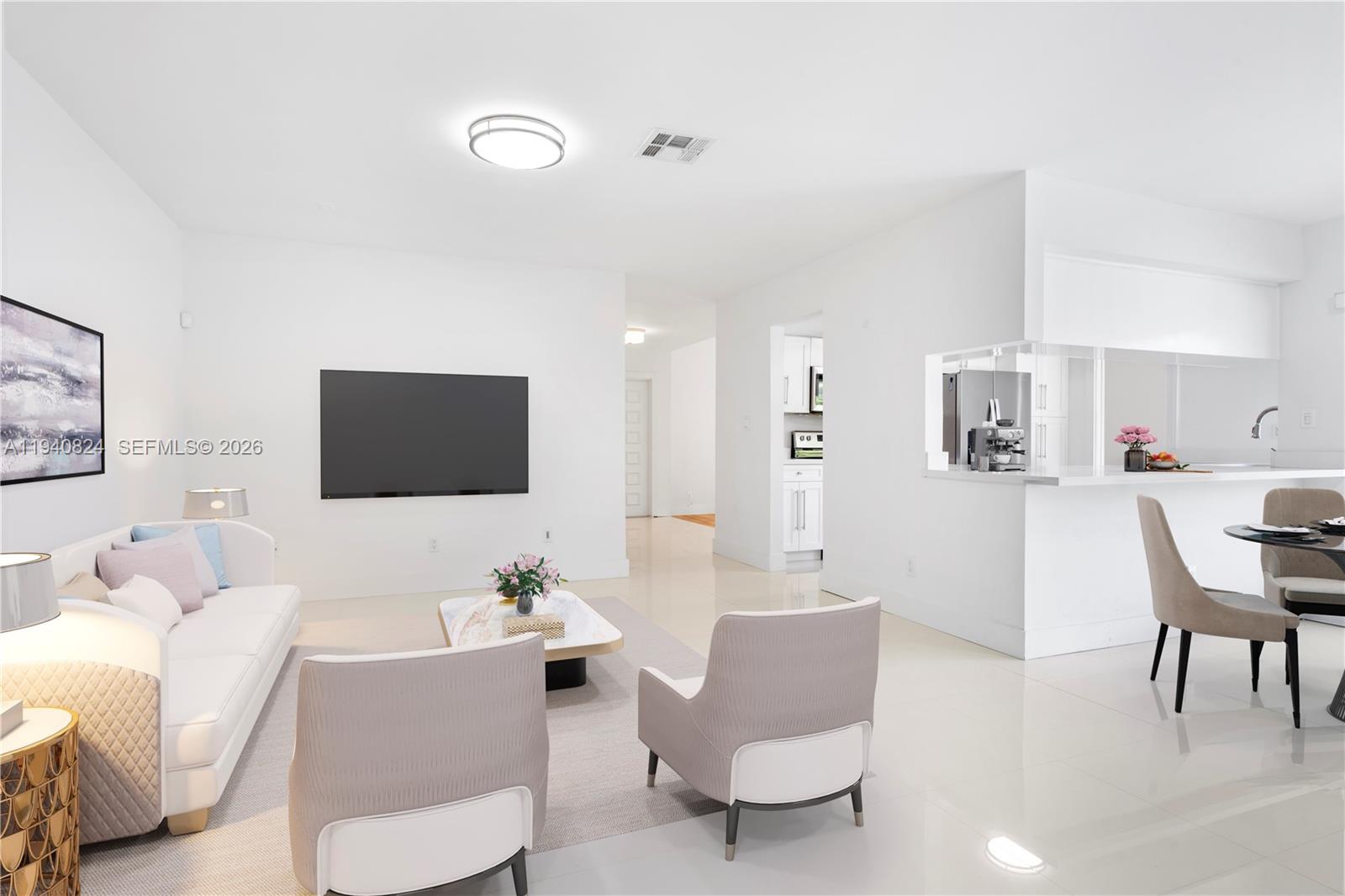 10424 Southwest 114th Court Miami, FL 33176 - Photo 6 of 23 a living room with furniture and a flat screen tv